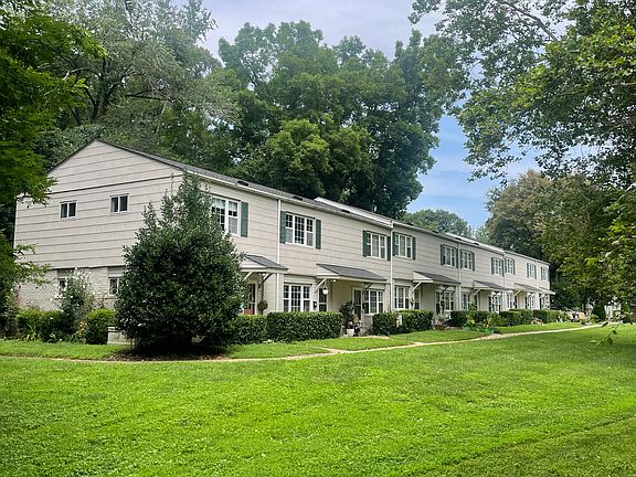 Wide green lawns and mature leafy trees