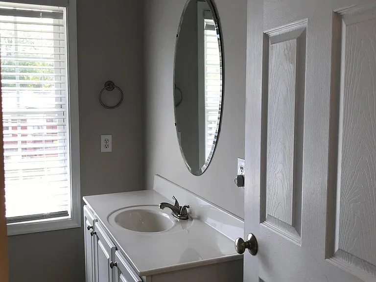 Full bath upstairs with single vanity, tub/shower and toilet