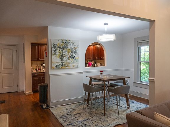 Dining room and kitchen (background)
(furnishings not included)
