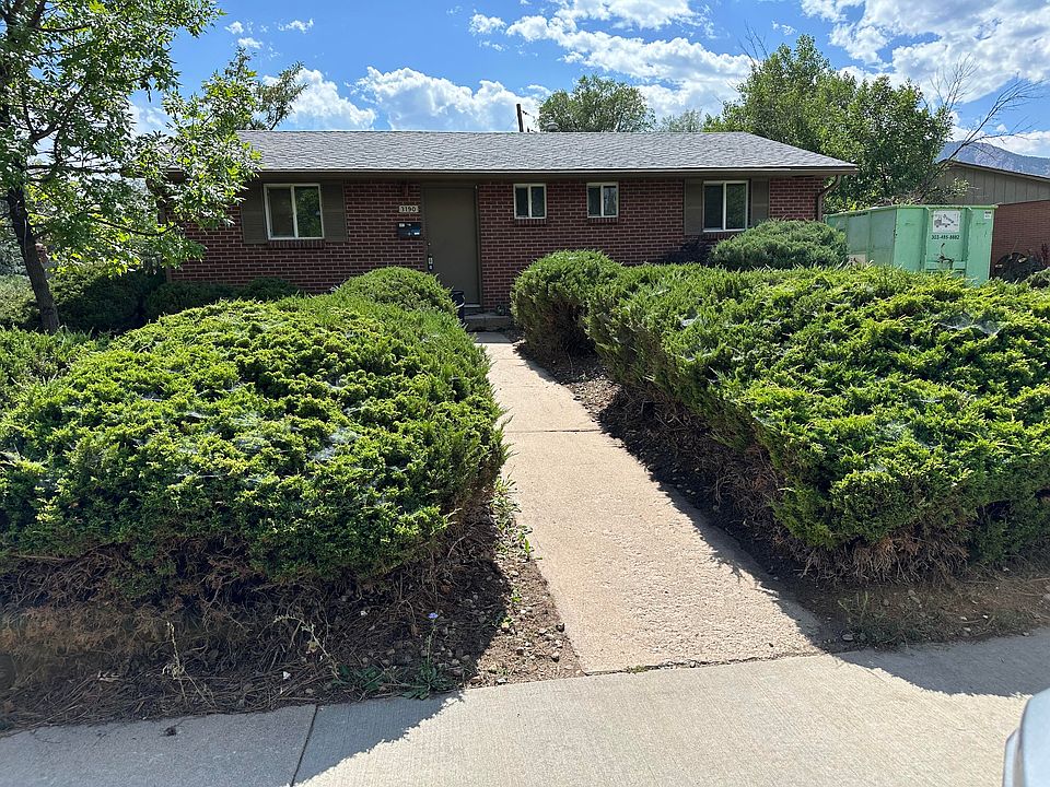 Front yard. House faces North. Driveway on the west side of house.