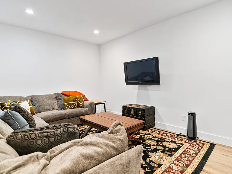 Downstairs has a second FULL living room with large comfy couch and TV