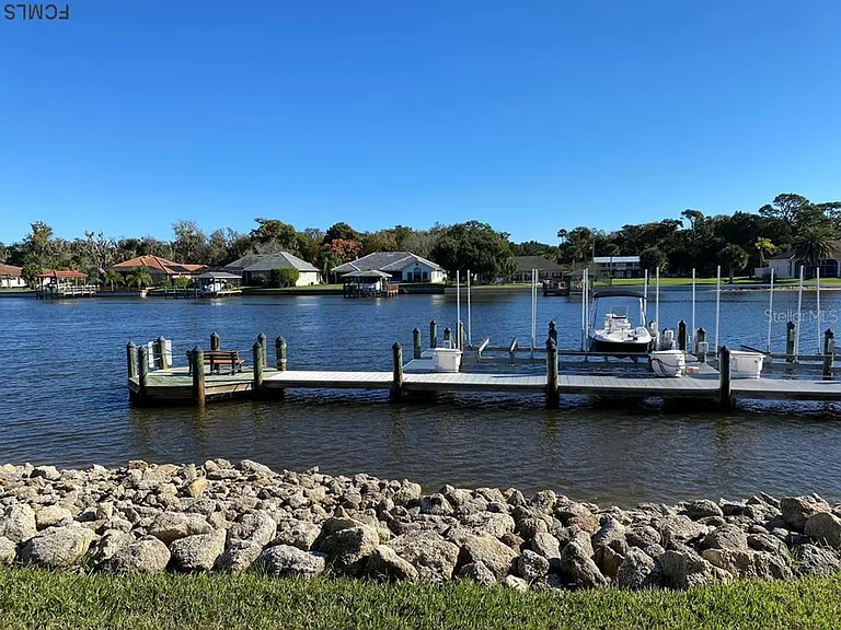 Marina and pier with bench for enjoying the water and watching the dolphins swim by