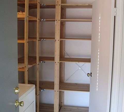 Large laundry room with lots of shelves