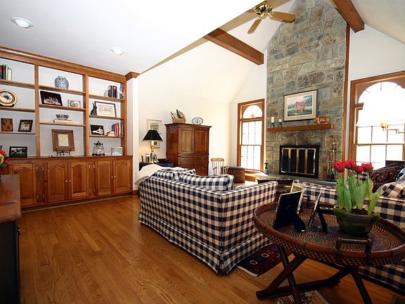 Soaring stone fireplace in Family Room