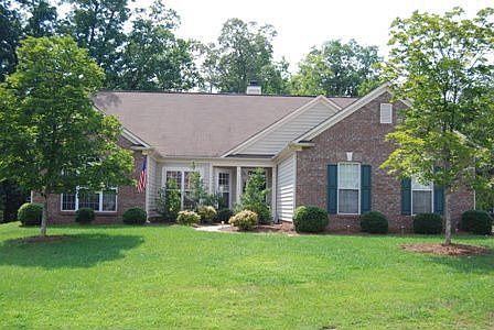 Fantastic Curb Appeal!  Side-load garage .45 acres!