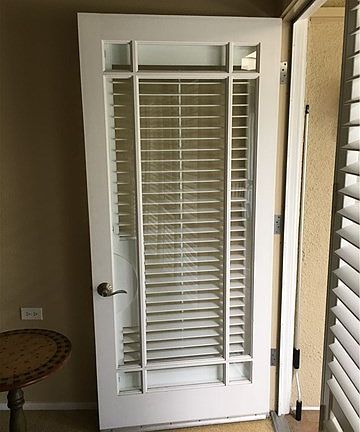 Glass door entry from front porch into home.
