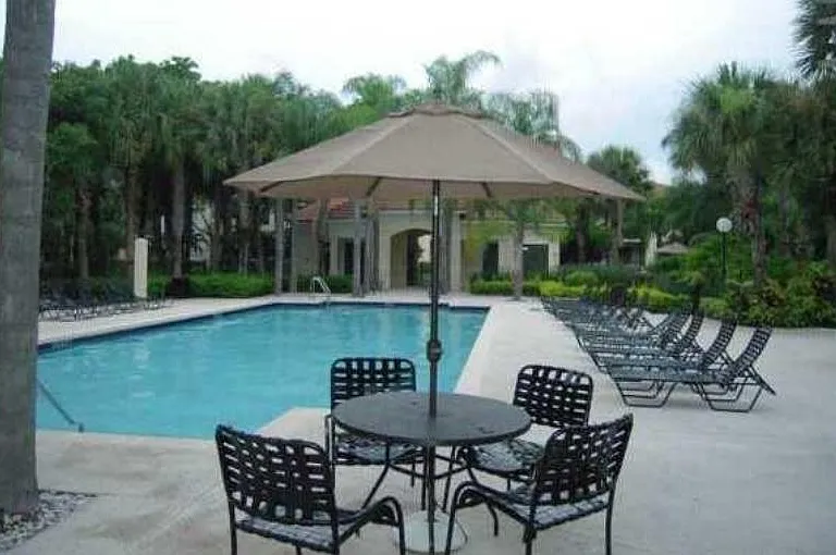 There are various tables and lounge chairs around both pools. Not shown is the community clubhouse and HOA office.