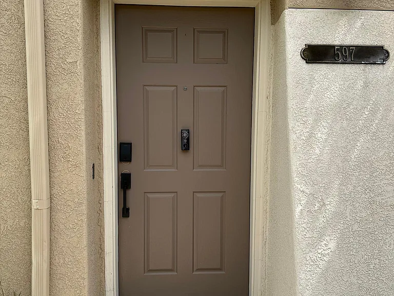Front door with keyless entry and eufy doorbell