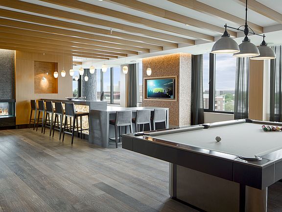 Connect, relax, and play in our stylish club room. A hub of community and comfort