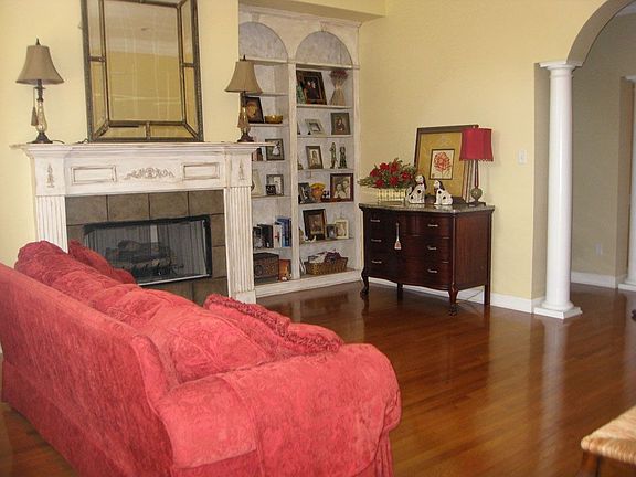 Living room has gas fireplace and built-ins.