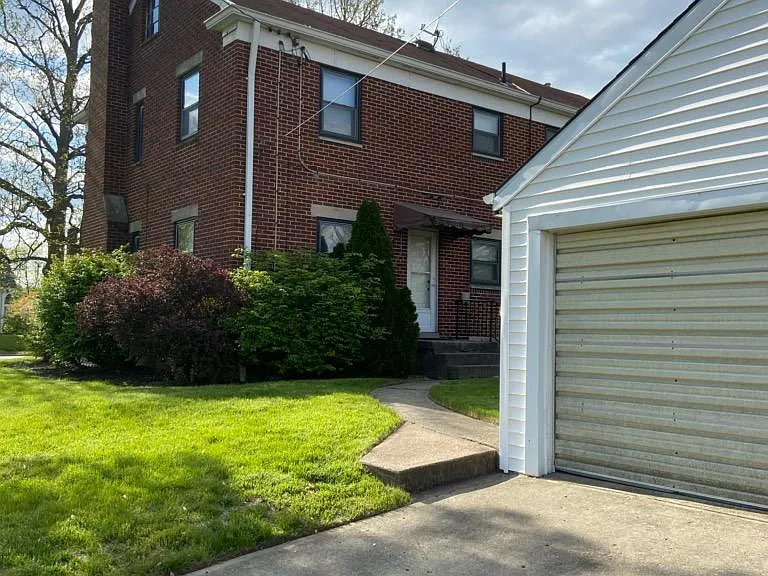 Large shared garage with additional off street parking.