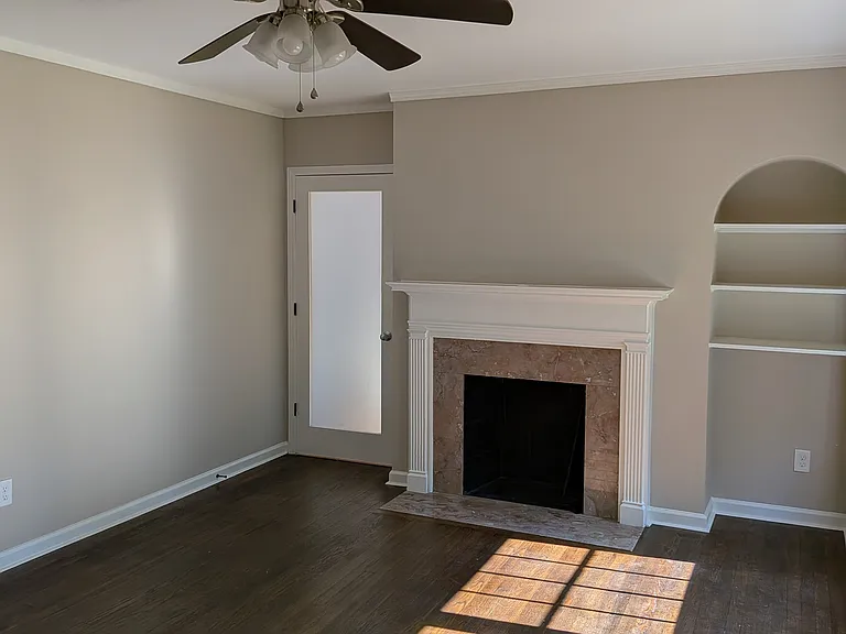 Living room with door to laundry