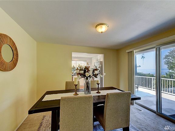 From the living and dining room you can enjoy the gorgeous view, along with glass door sliders to enter your large deck.