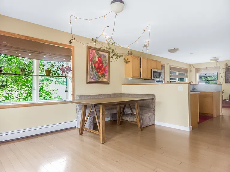 Dining room with kitchen and living room beyond