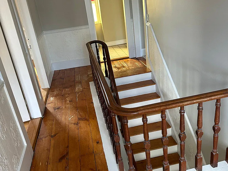 Upstairs Hallway. Bathroom door at end