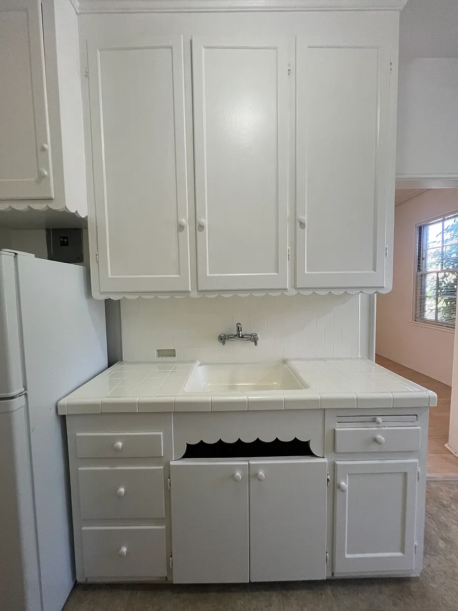Vintage kitchen with original trim and ample cabinets - 145 S Reeves Dr #101