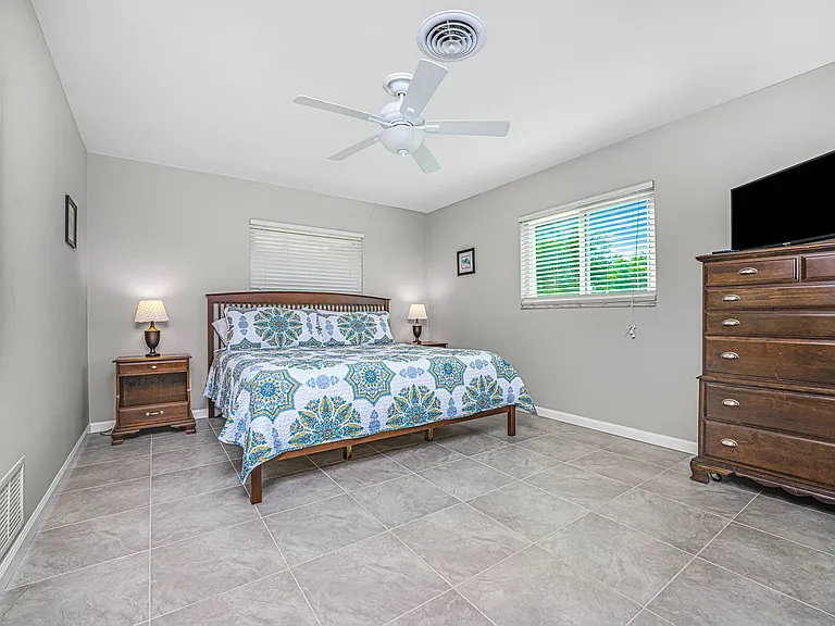 Large primary bedroom with lots of light