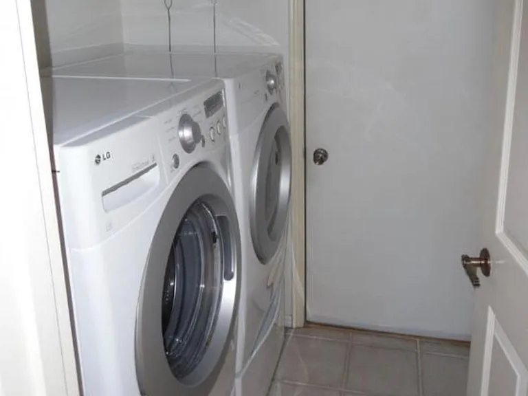 Front loading washer and dryer provided