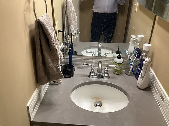 Extra separate sink in upstairs bathroom across from the door to the toilet
