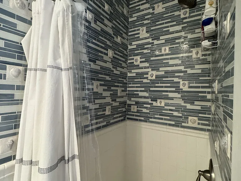 Upgraded step-in shower.