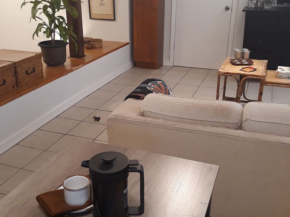 View from kitchen cafe table toward office/den, execise room door