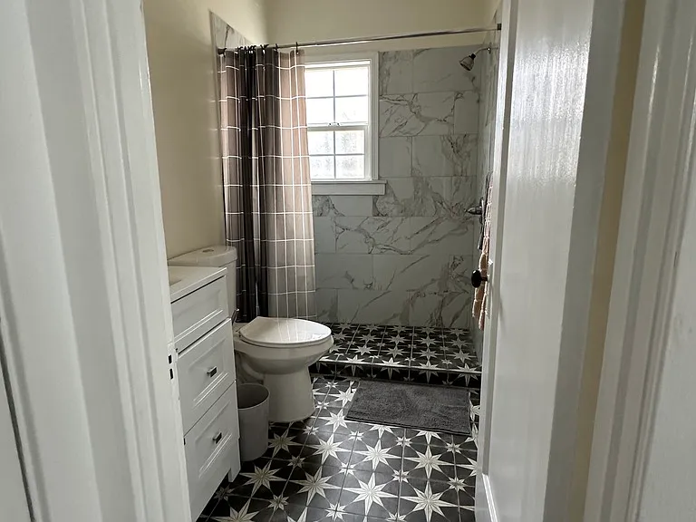 Bathroom with walk in shower.