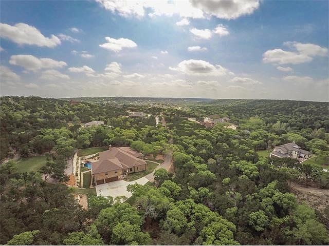 Welcome to the most beautiful property in Crystal Falls! This Executive Estate is surrounded by gorgeous Hill Country views!