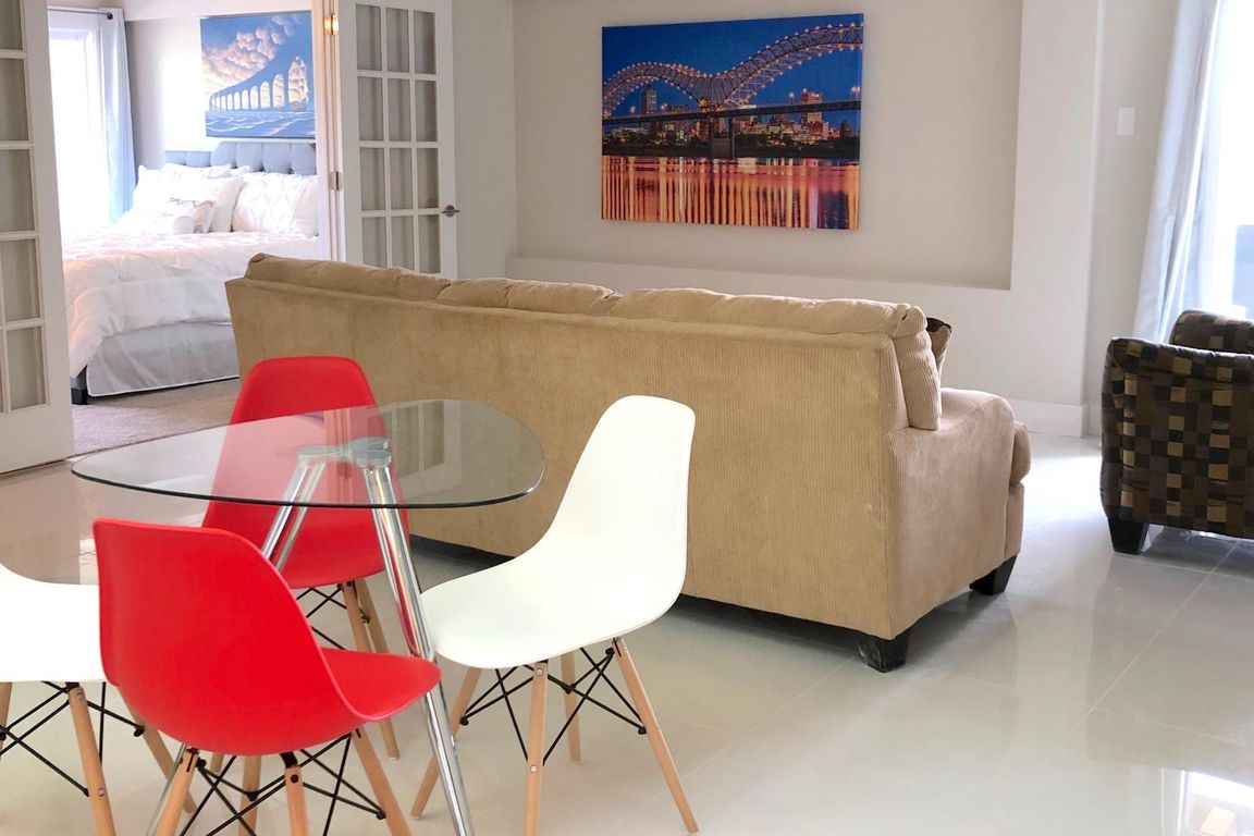 The Pat: 1 BD / 1BA. French doors. Ultra-modern white tile. Shown with transitional decor.