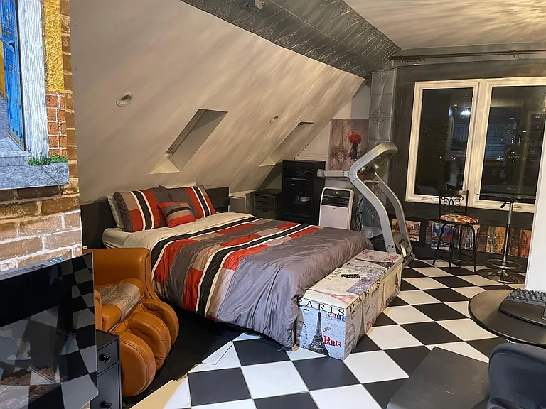 Queen size bed with massage chair on one side and the treadmill. Winter Bedding.