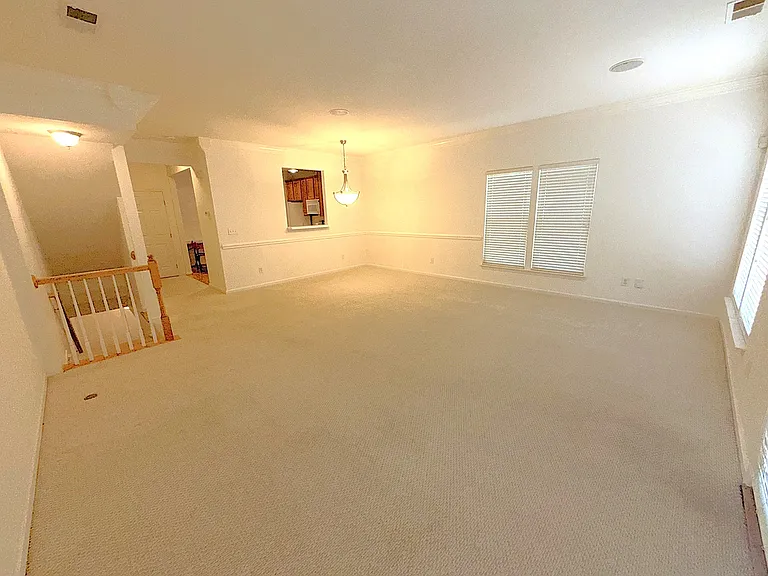 -2nd floor Large Living and Dining room. 
-The carpet on stairs will be replaced by LVP plank flooring.