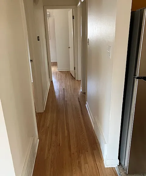 Hallway to 3 bedrooms and main bathroom
