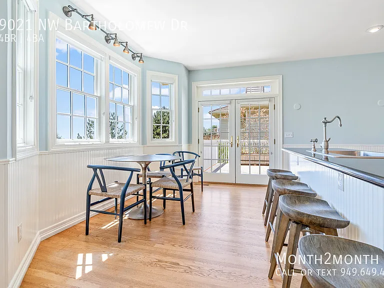 9021 NW Bartholomew Dr — Photo 32