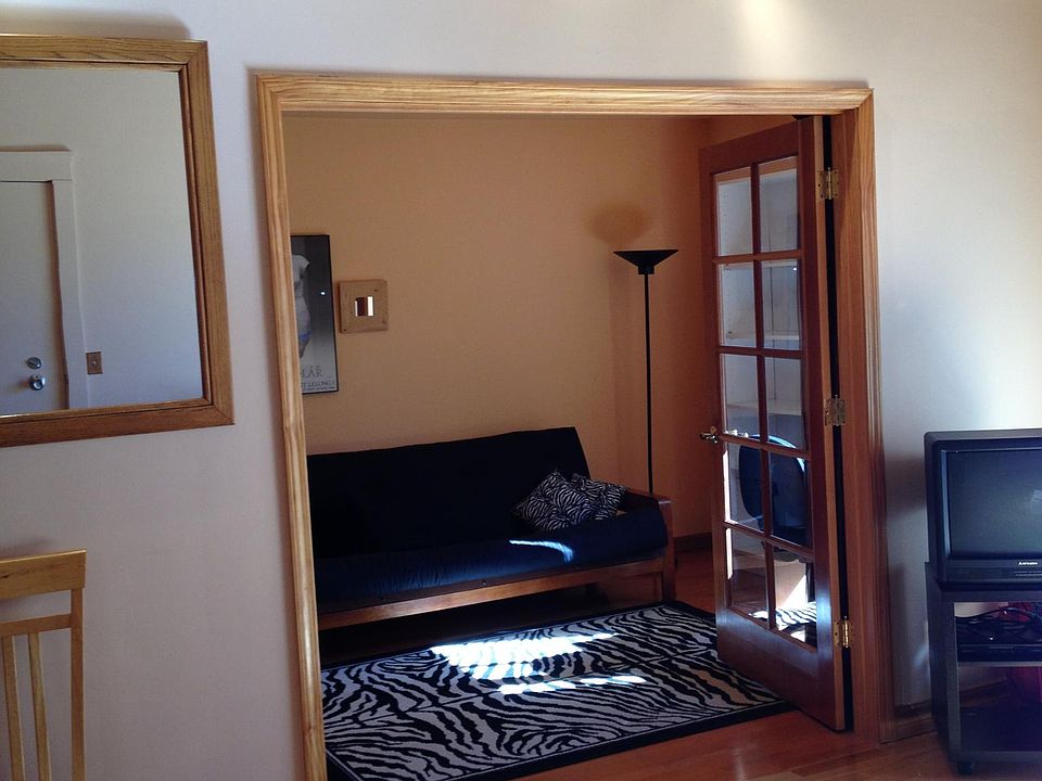 Living room and second bedroom-can also be used as a den or study. Wood French doors with blackout drapes (not shown in photo) Track lighting