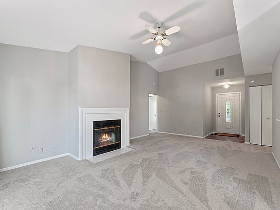 Handsome Fireplace and New Carpeting.