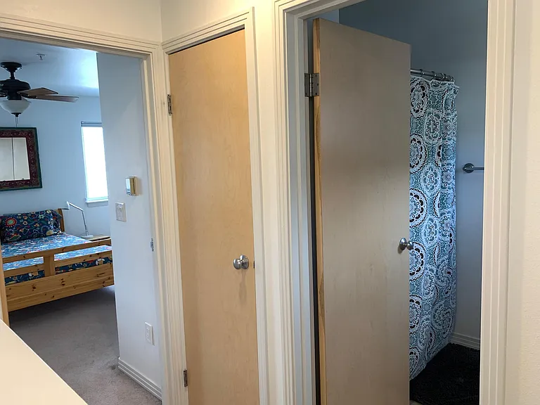 Linen closet behind middle door.
