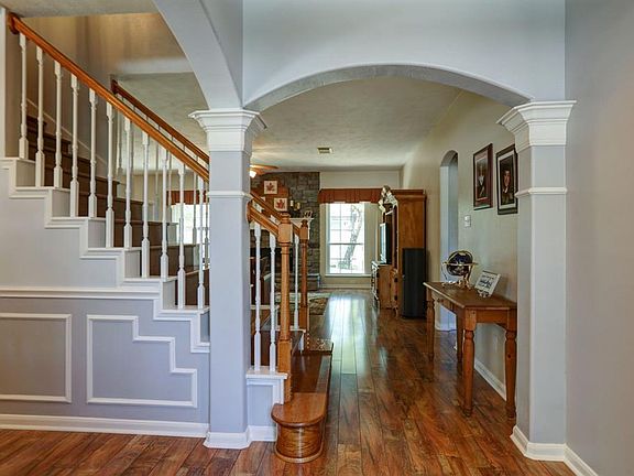 Inviting and open entry welcomes you in. Home features beautiful new wood floors!