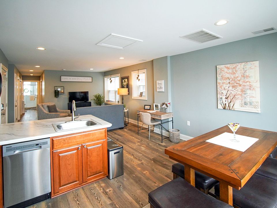 KITCHEN & DINING AREA LOOKING OUT TO OFFICE AREA AND LIVING ROOM