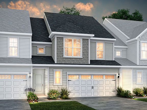 Palomino Exterior 5 features siding, shakes, covered front door and 2-car front load garage