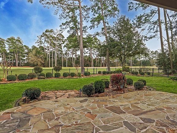 Who doesn't want an incredible view like this! So serene and on a private part of the golf course! Cart path on the opposite site of the course. Fully landscaped flower beds surround the exterior of the yard and offers an extended flagstone patio!