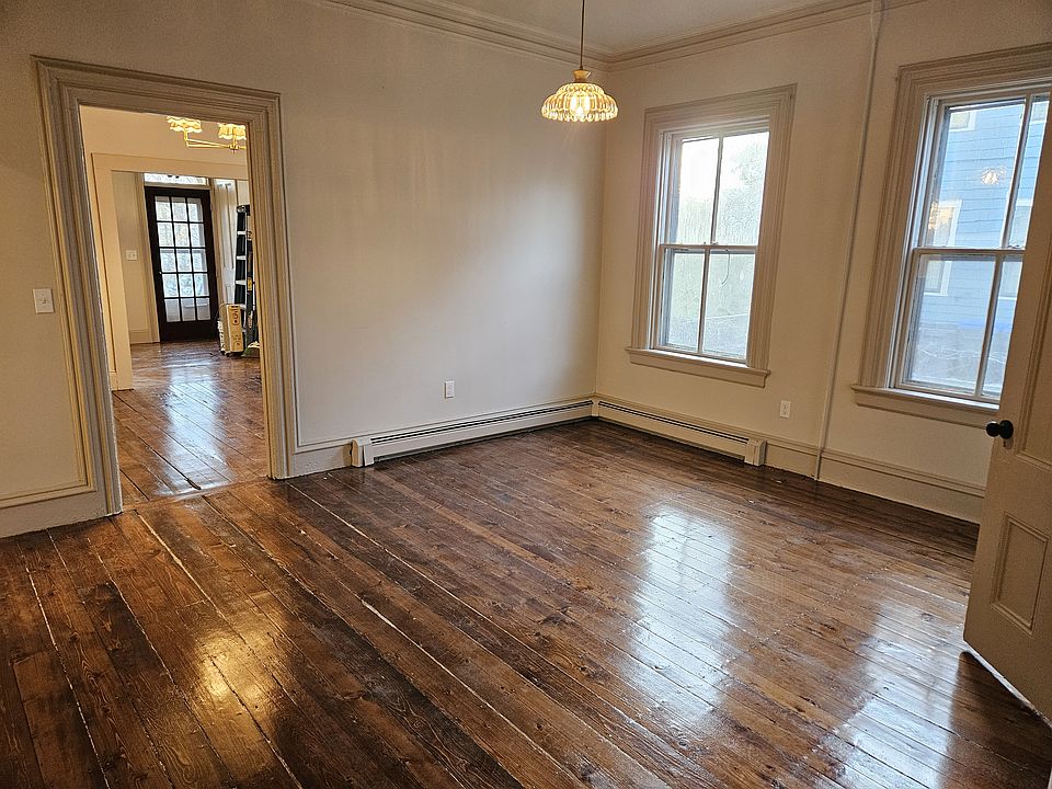 Cozy living room with lots of natural light and hardwood floors