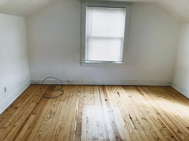 Bedroom #3 (master bedroom) - freshly painted with refurbished hardwood floor. 3 windows for lots of natural light!
