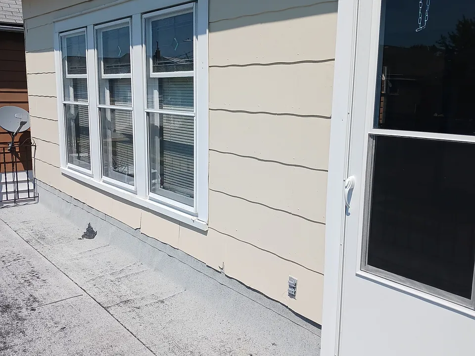 Upper porch with new storm door & new exterior steel door.