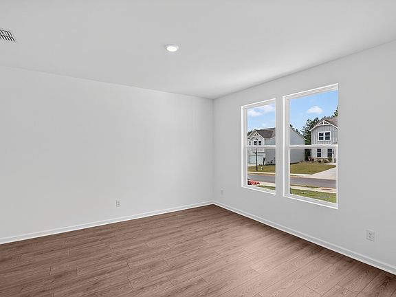 Versatile flex room with abundant natural light and durable hard-surface flooring