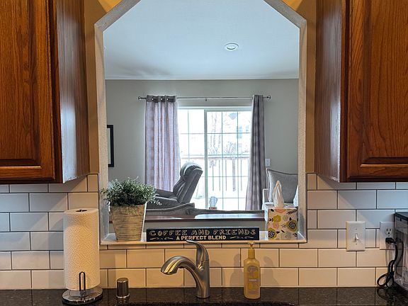 Kitchen into Living Room. Allows person in the kitchen to be part of those in Living Room
Granite counter to and Subway Tile Backsplash. Wall color is not true example