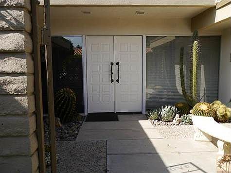 Large Beautifully Landscaped Gated Courtyard.  Impressive Double Door Entry