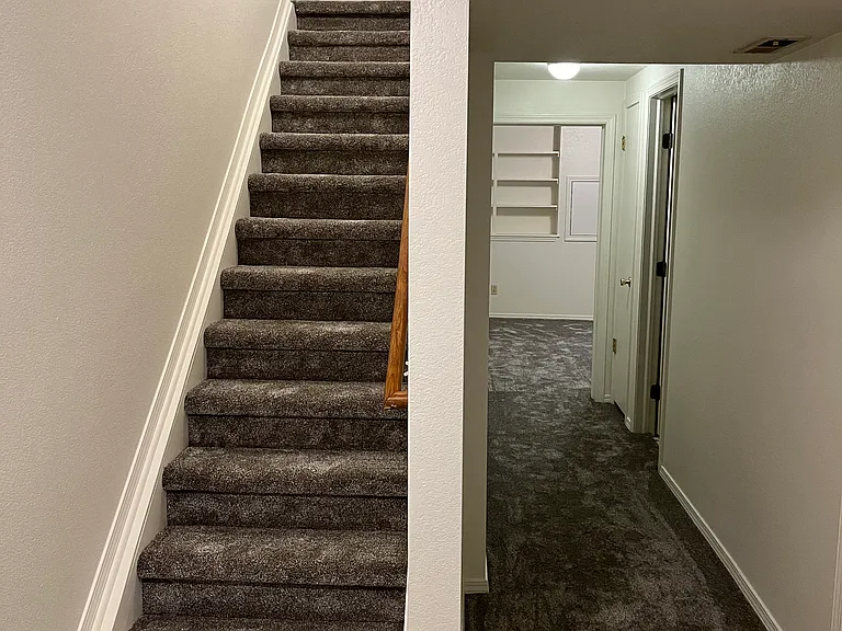 Basement stairs and hallway...brand NEW carpet on entire basement level