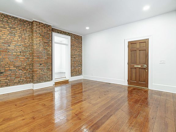 Front door, 1st floor living room and entry way to dining room