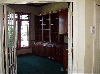Den with built in Cherry Cabinets
