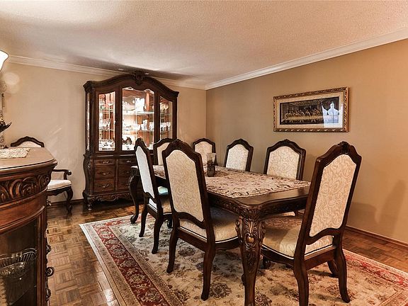 The entryway door has side windows and the coat closet is straight ahead of the door.