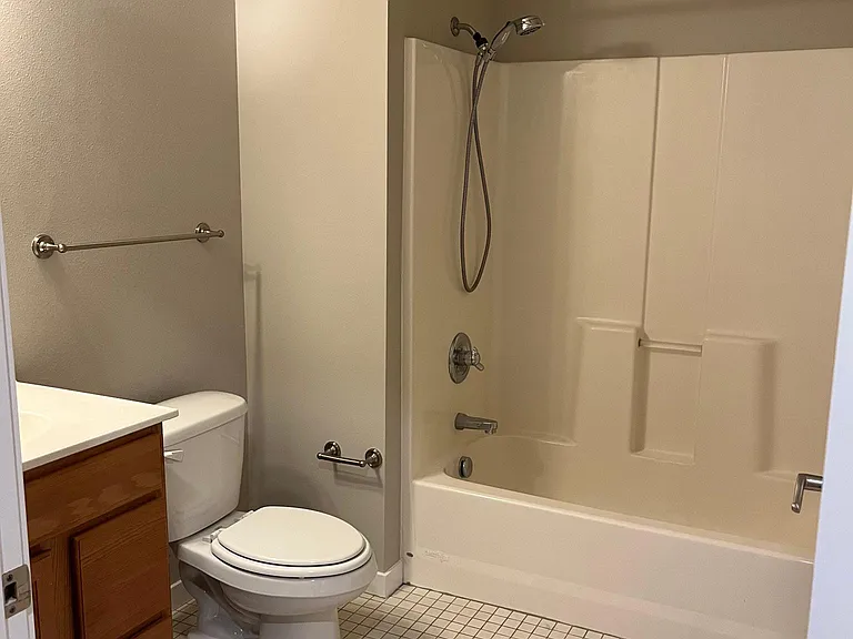 Full bathroom, across the hall from second bedroom